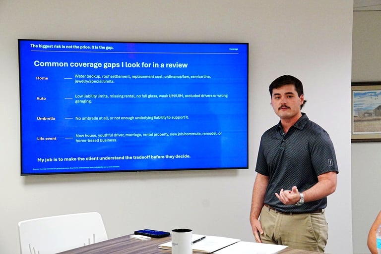 Man in dark shirt presenting to a blue screen displaying common coverage gaps for product reviews in an office setting